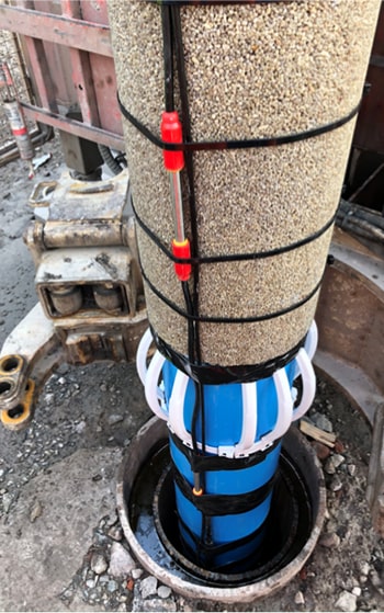 Illustration of person scanning borehole core